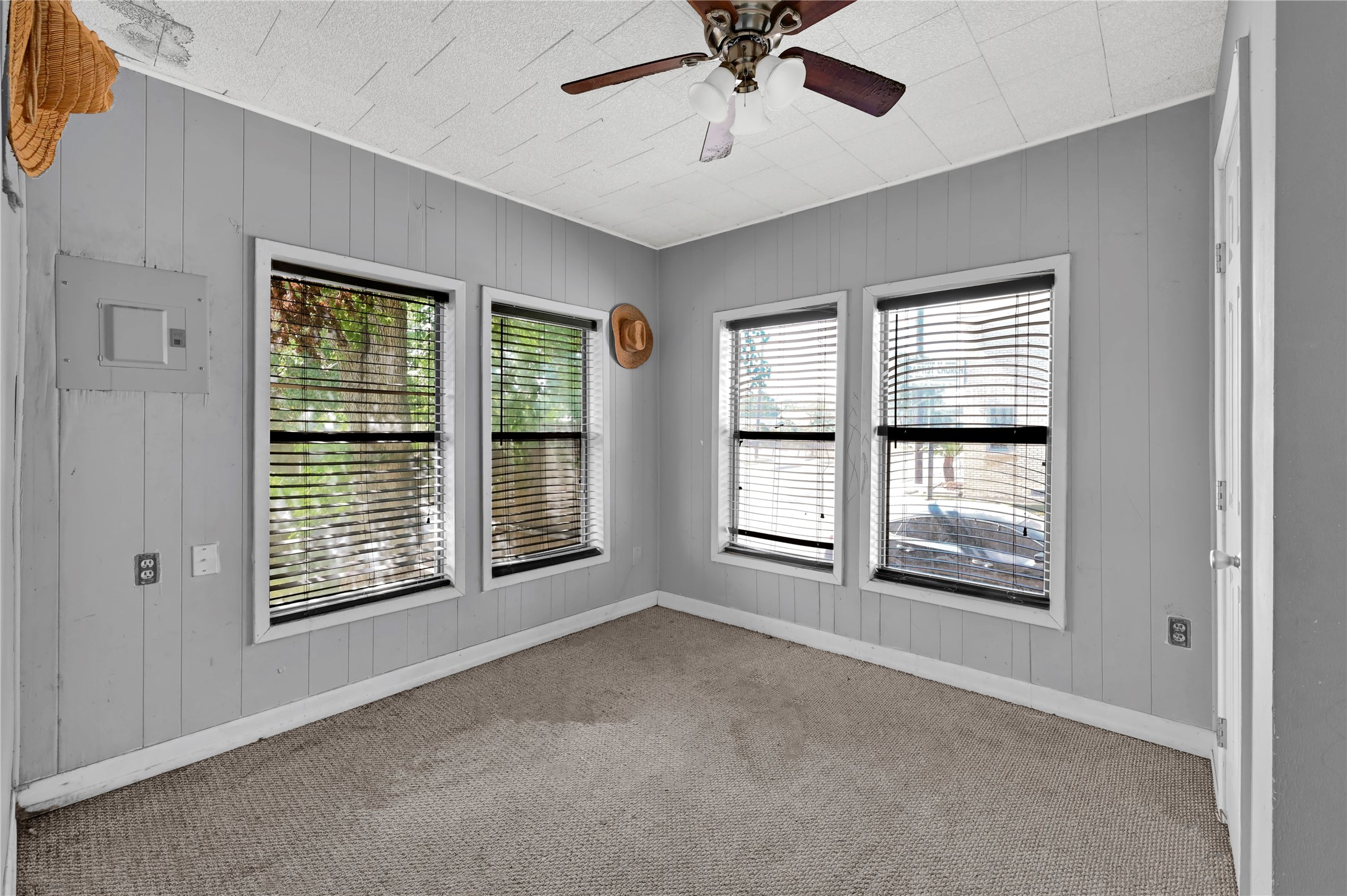 720 Yupon Street Baytown, TX 77520 - Photo 8 of 15 a view of an empty room with chandelier fan and fire place