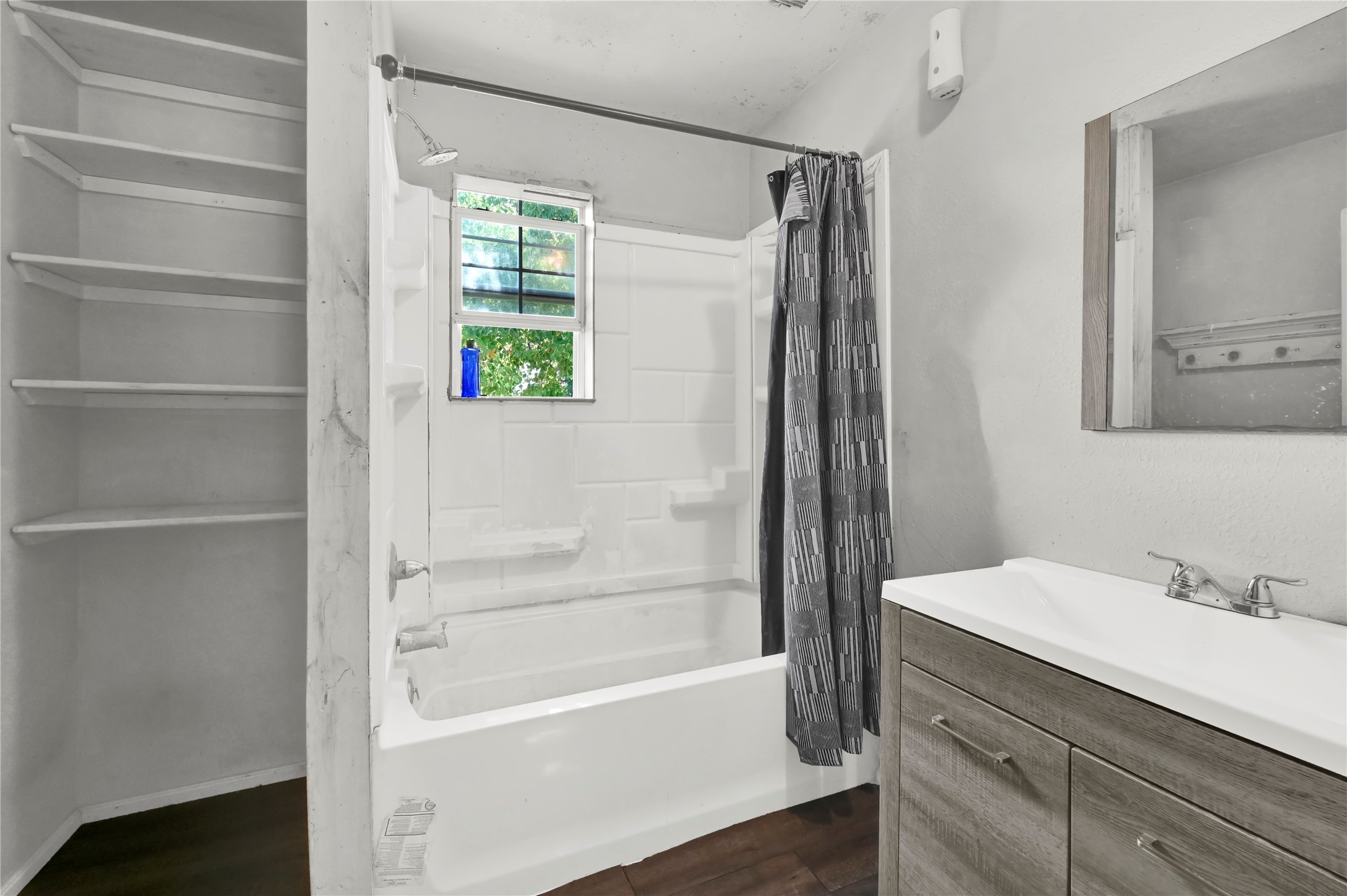 720 Yupon Street Baytown, TX 77520 - Photo 9 of 15 a bathroom with a bathtub and a sink