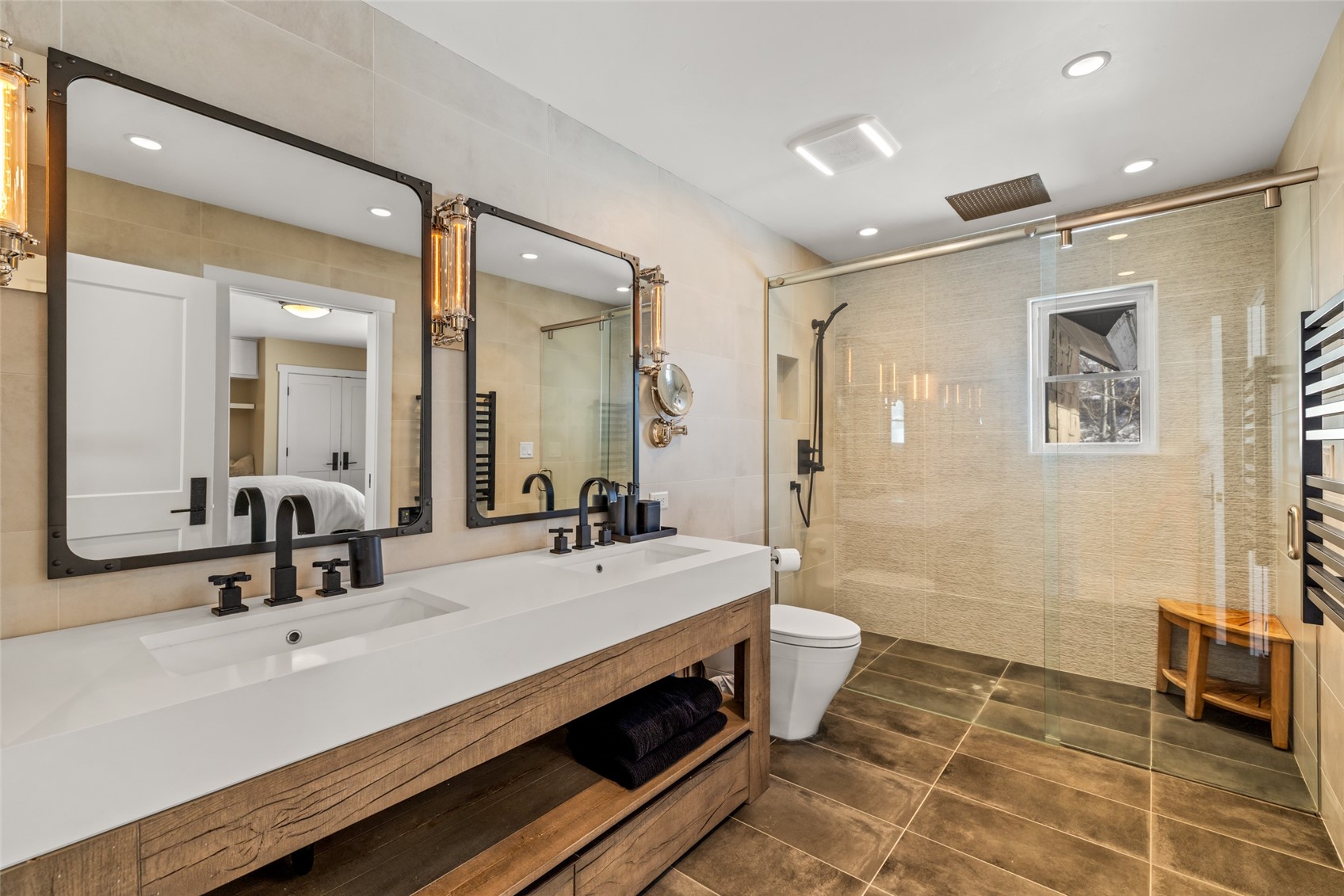 31655 Sugar Ridge Road Steamboat Springs, CO 80487 - Photo 47 of 49 a bathroom with a double vanity sink a mirror and a shower