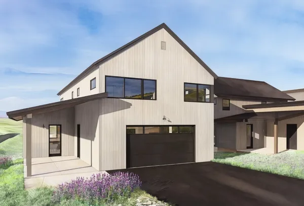 a front view of a house with garage