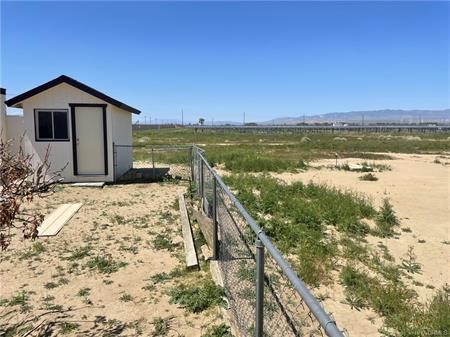 11985 Gaskell Road Rosamond, CA 93560 - Photo 10 of 12 a view of a lake with a mountain