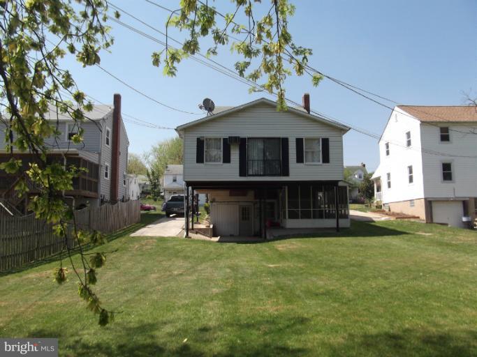 5553 Ashbourne Road Halethorpe, MD 21227 - Photo 3 of 23 a view of a house with a yard
