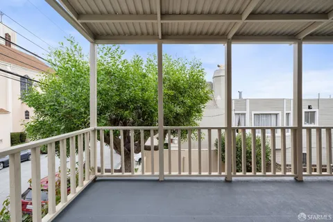 a view of an empty room with a fireplace