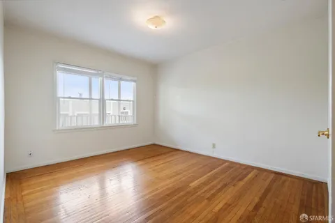 a bathroom with a sink mirror vanity and toilet