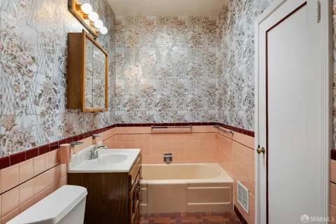 a view of a street with trees in front of it