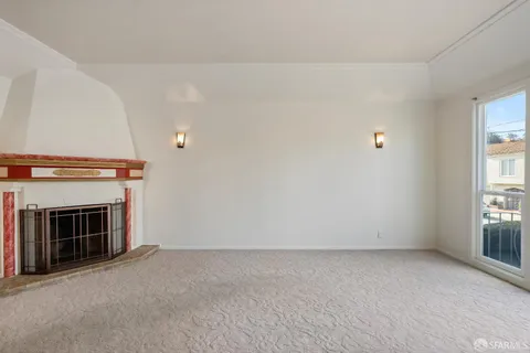 a kitchen with stainless steel appliances granite countertop a refrigerator a sink dishwasher a dining table and chairs with wooden floor