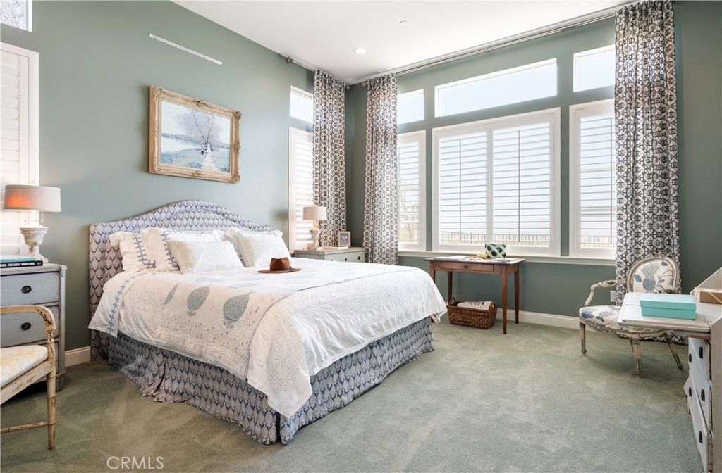 1650 Eucalyptus Road Nipomo, CA 93444 - Photo 19 of 60 a bedroom with a bed chair and window