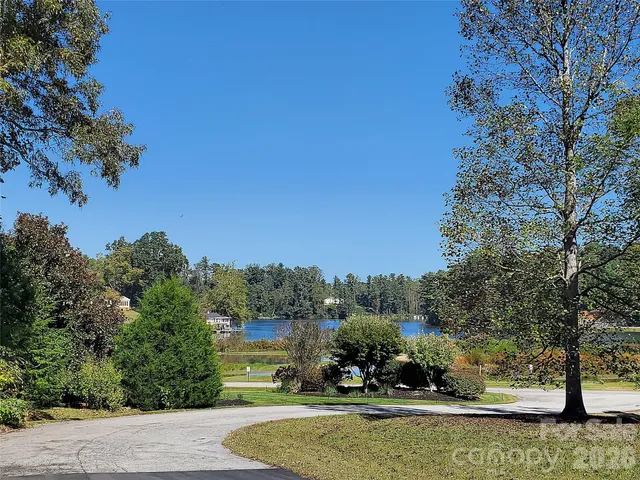 a view of a lake with a house in the background