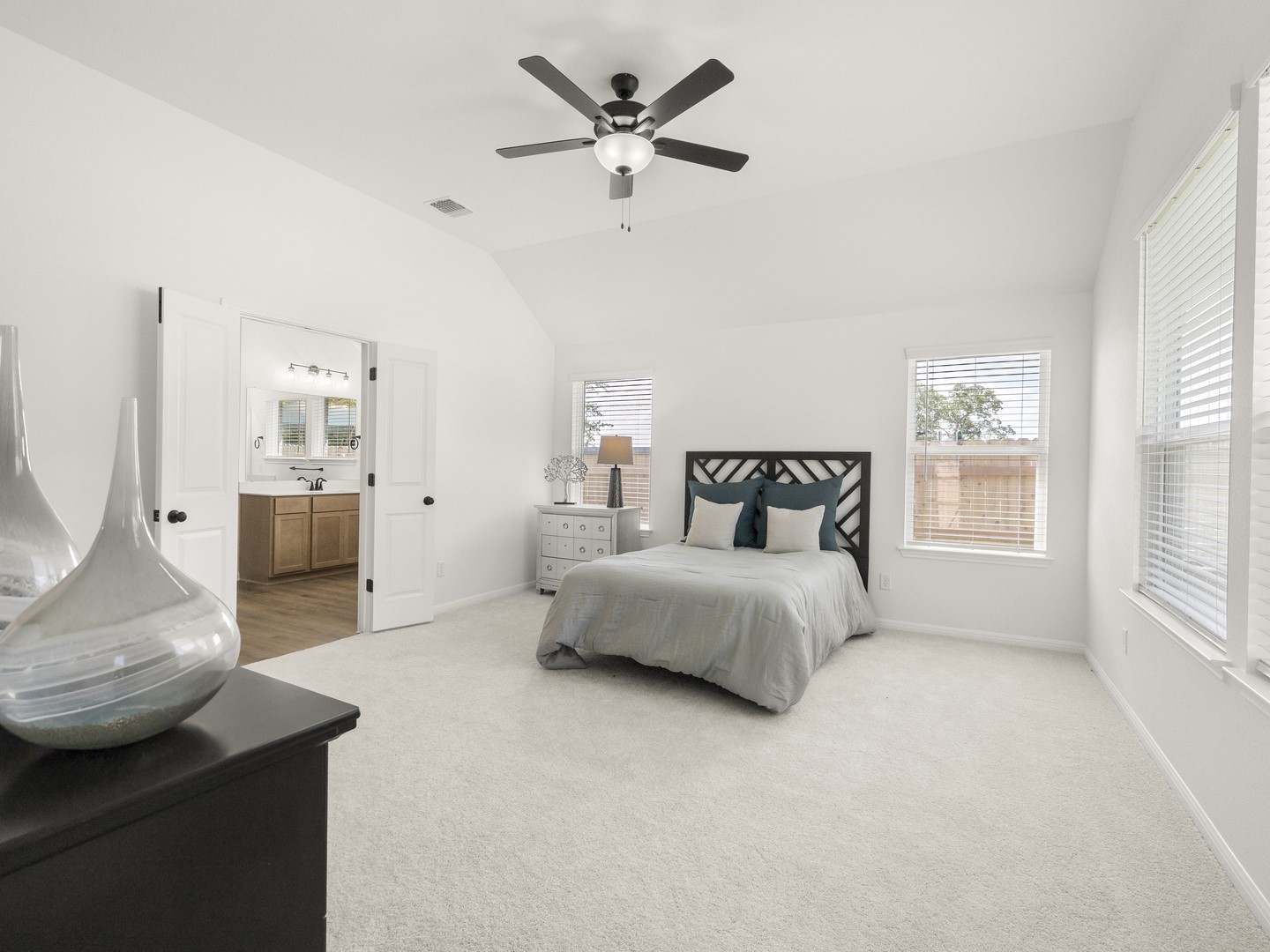 402 Judson Street Bertram, TX 78605 - Photo 12 of 27 a spacious bedroom with a bed and window