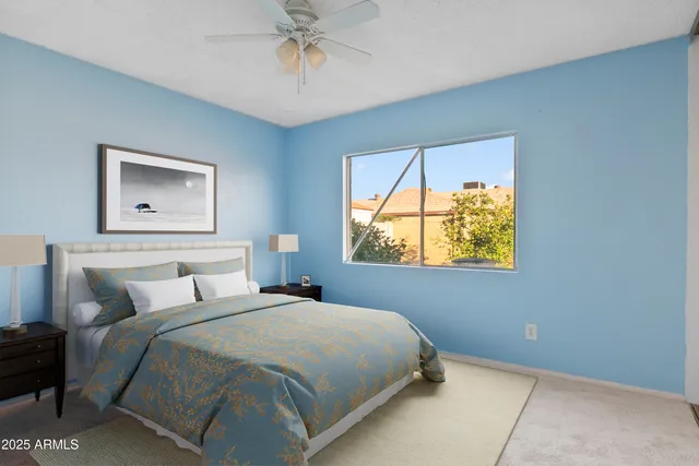 a bedroom with a bed and window