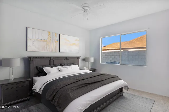 a bedroom with a bed and a window