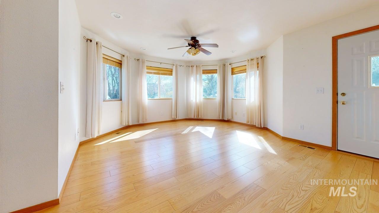2794 9th Avenue Clarkston, WA 99403 - Photo 11 of 34 Spare room with a ceiling fan and light wood finished floors
