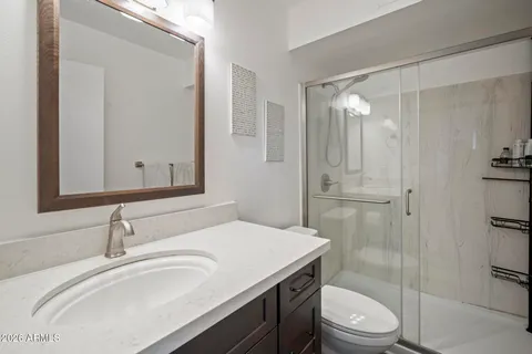 a bathroom with a shower curtain and a shower curtain