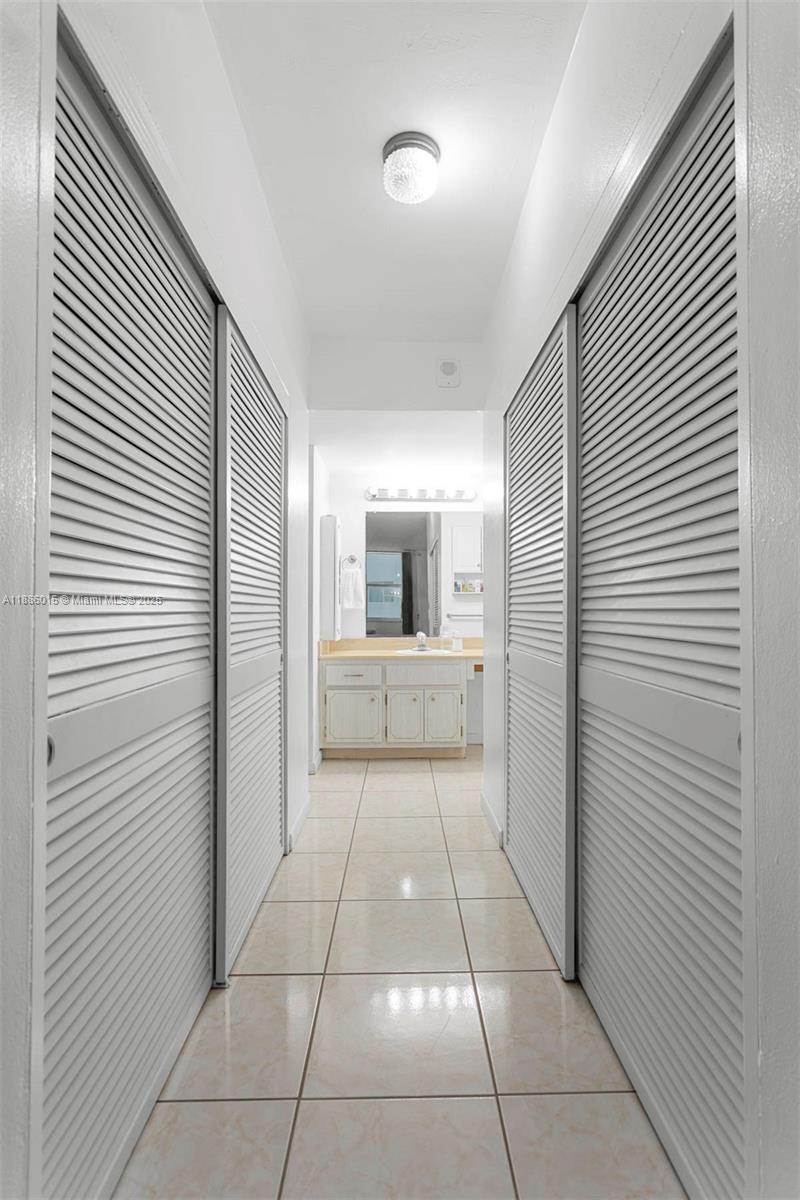 5001 Collins Avenue, Unit 5E Miami Beach, FL 33140 - Photo 11 of 17 a view of a hallway in a house