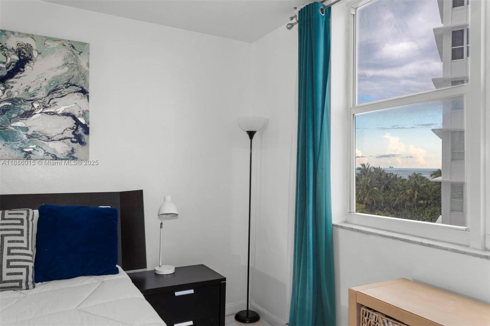 5001 Collins Avenue, Unit 5E Miami Beach, FL 33140 - Photo 2 of 17 a bedroom with a bed and a dresser