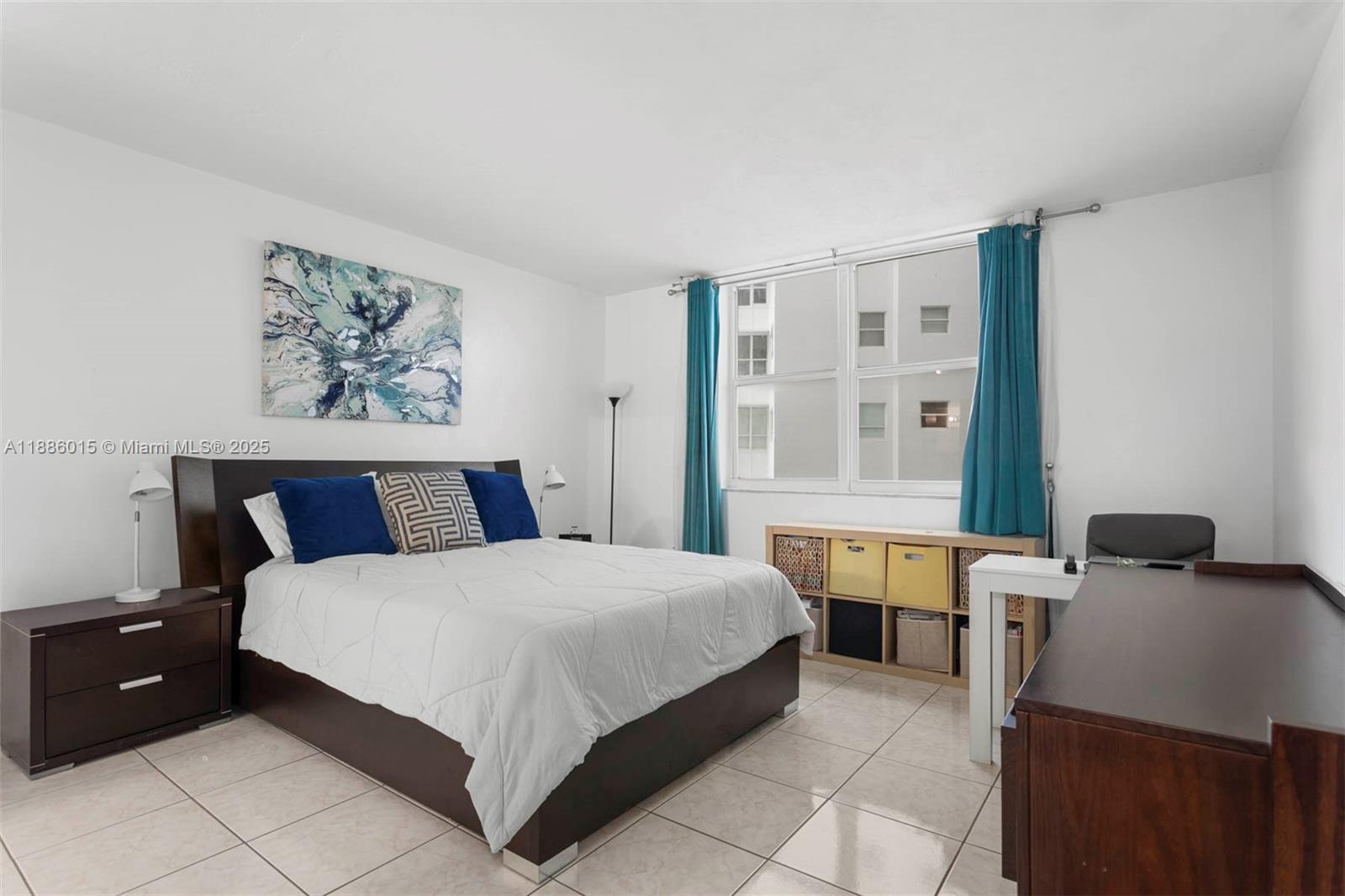 5001 Collins Avenue, Unit 5E Miami Beach, FL 33140 - Photo 5 of 17 a bedroom with a bed and a window