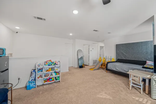 a bedroom with furniture and a bed