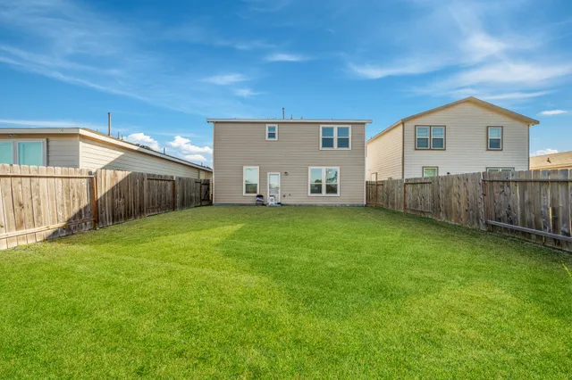 a front view of house with yard and seating area