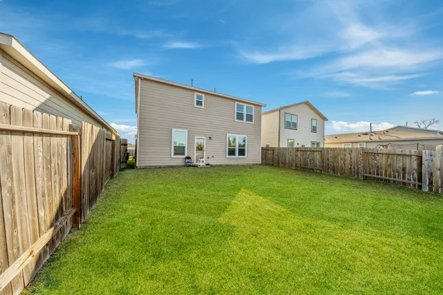 a view of a back yard of the house