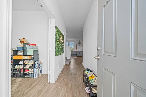 a view of an entryway with wooden floor