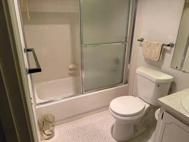 a bedroom with a bed and a chair