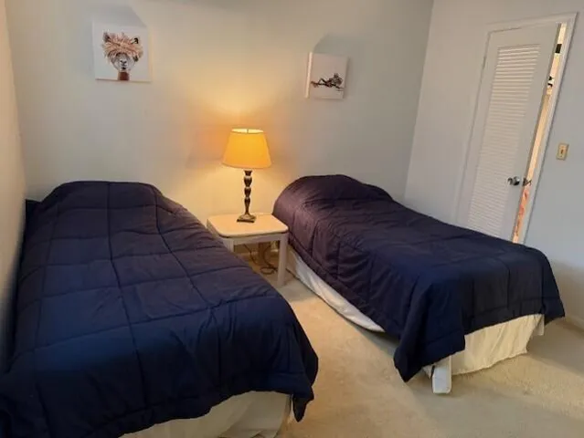 a bedroom with a bed and a view of bathroom