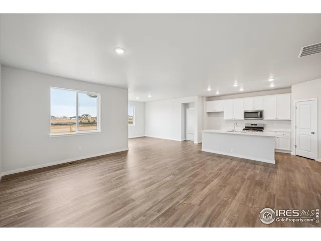 a view of kitchen with wooden floor