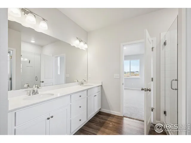 a bathroom with a glass shower door