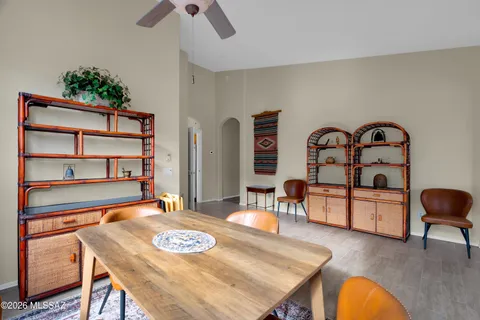 a dining room with a table and chairs