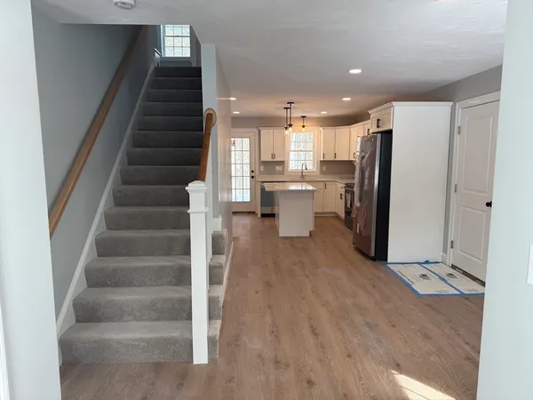 a view of entryway with kitchen