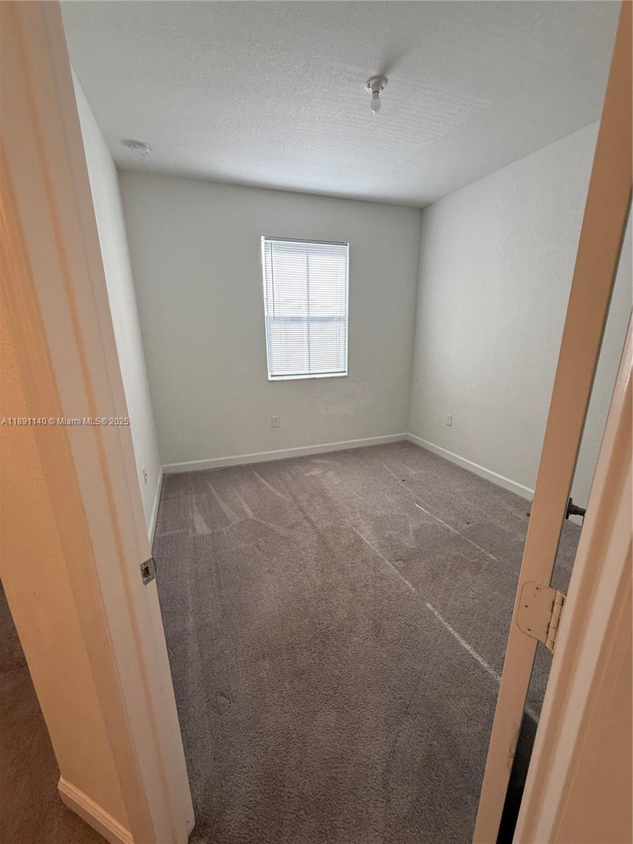 1021 Southeast 27th Street, Unit 1021 Homestead, FL 33035 - Photo 10 of 26 2nd Bedroom