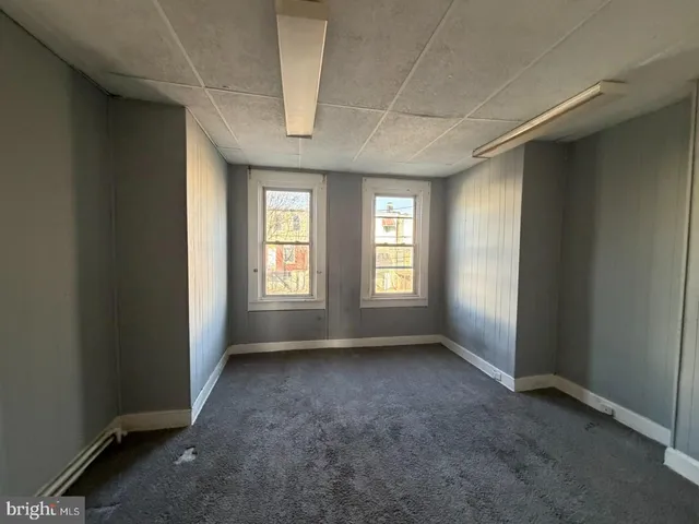 an empty room with windows