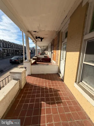 a bathroom with a sink a toilet a mirror and shower