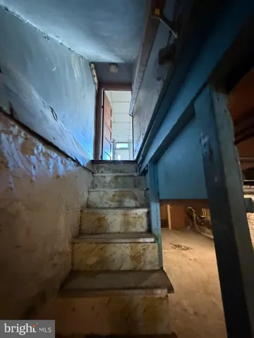 a view of a patio with table and chairs potted plants