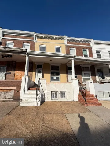 a front view of a building with parking space