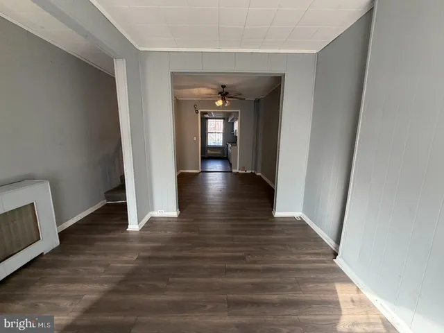 a view of gallery with wooden floor