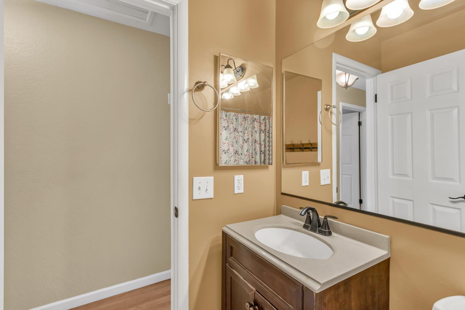 8069 Cornerstone Way Citrus Heights, CA 95621 - Photo 12 of 27 a bathroom with a sink and a mirror