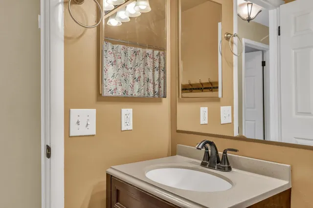 a bathroom with a sink and a mirror