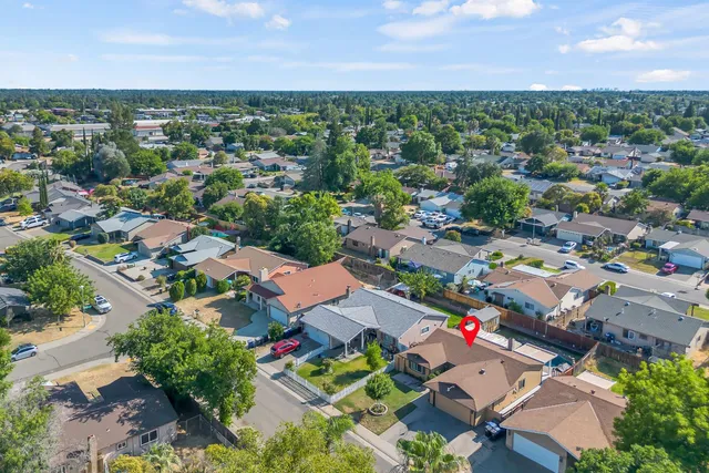 an aerial view of residential houses with outdoor space