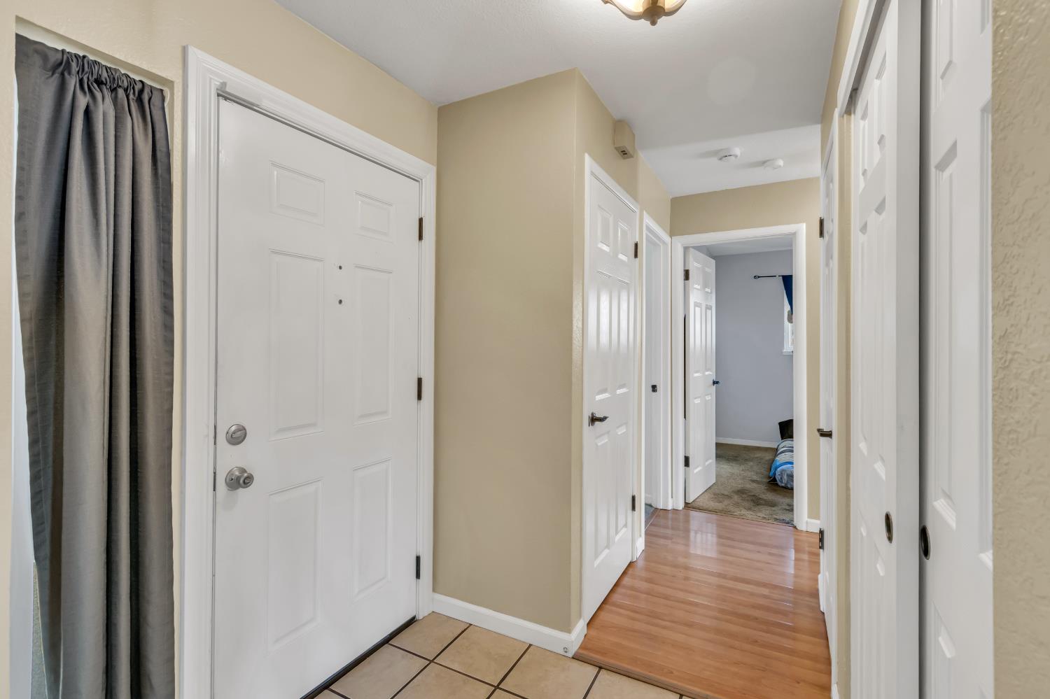 8069 Cornerstone Way Citrus Heights, CA 95621 - Photo 24 of 27 a view of a hallway with wooden floor and a bathroom