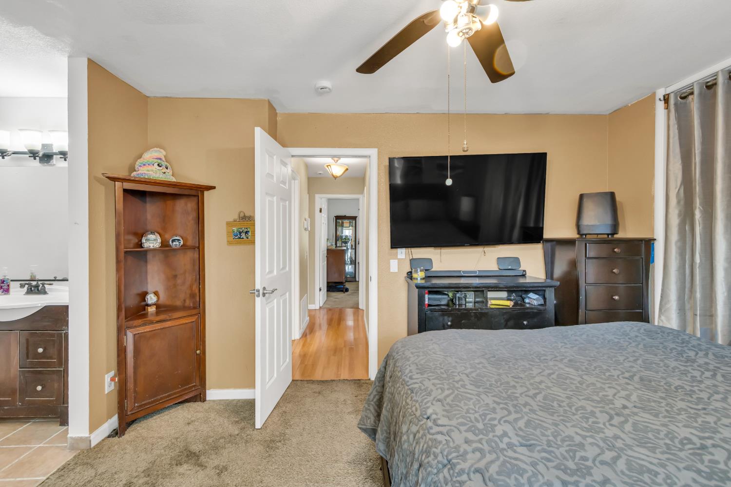 8069 Cornerstone Way Citrus Heights, CA 95621 - Photo 27 of 27 a bedroom with a bed and a television