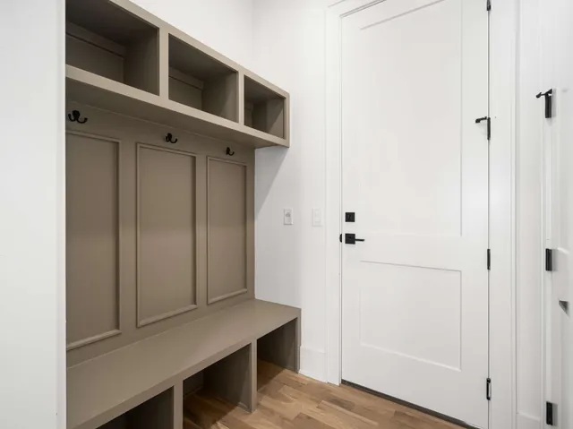 a view of an entryway with wooden floor