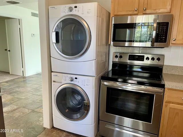a kitchen with a stove and a microwave
