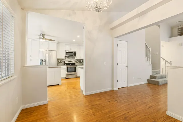 a view of kitchen and wooden floor