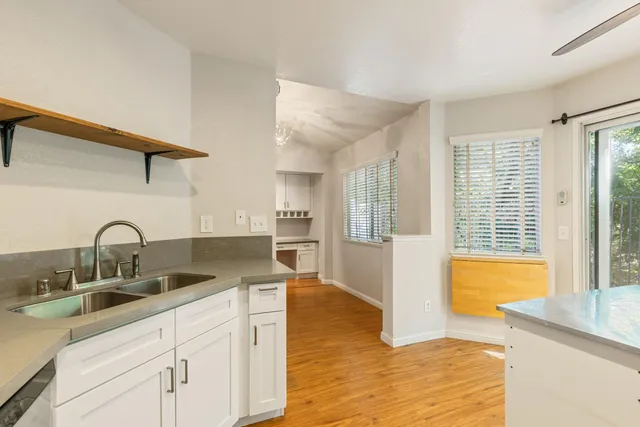 a kitchen with a sink and a refrigerator
