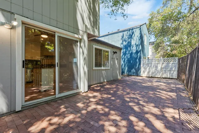 a view of a house with a backyard