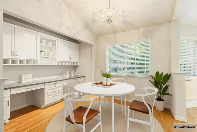 a view of a dining room with furniture and window