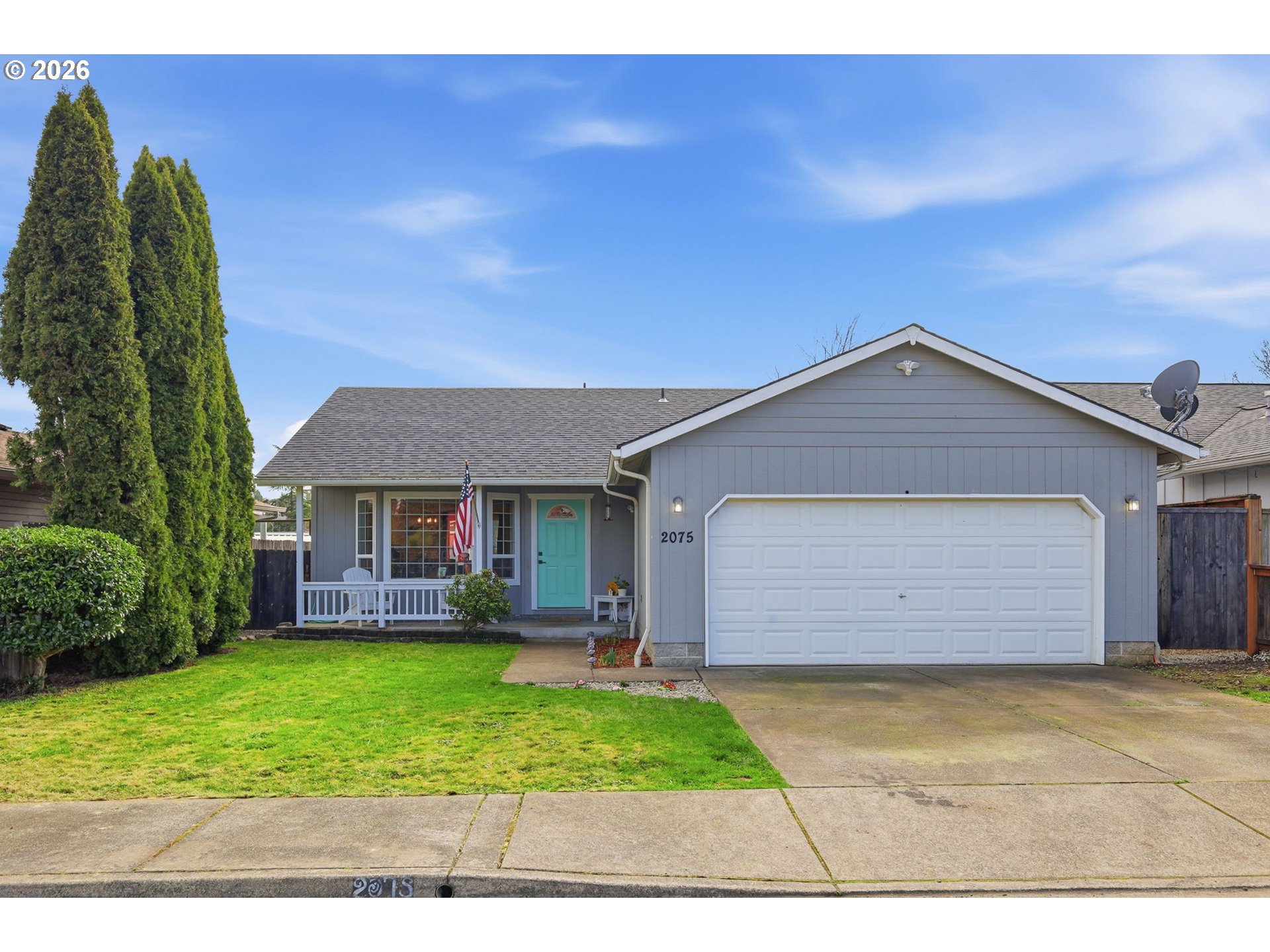 2075 Bryant Avenue Cottage Grove, OR 97424 - Photo 1 of 29 a front view of a house with a garden and plants