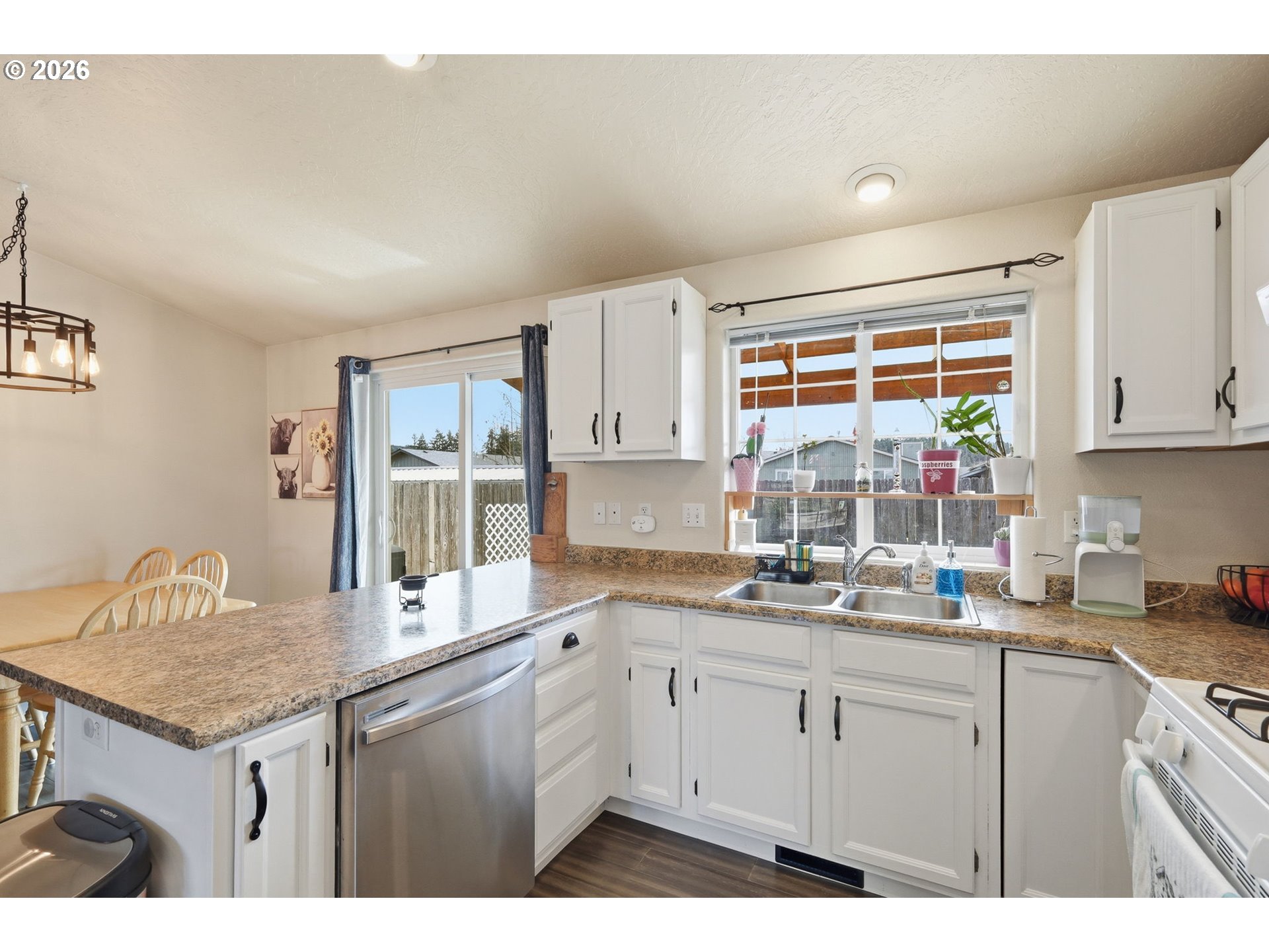 2075 Bryant Avenue Cottage Grove, OR 97424 - Photo 11 of 29 a kitchen with a sink dishwasher and cabinets