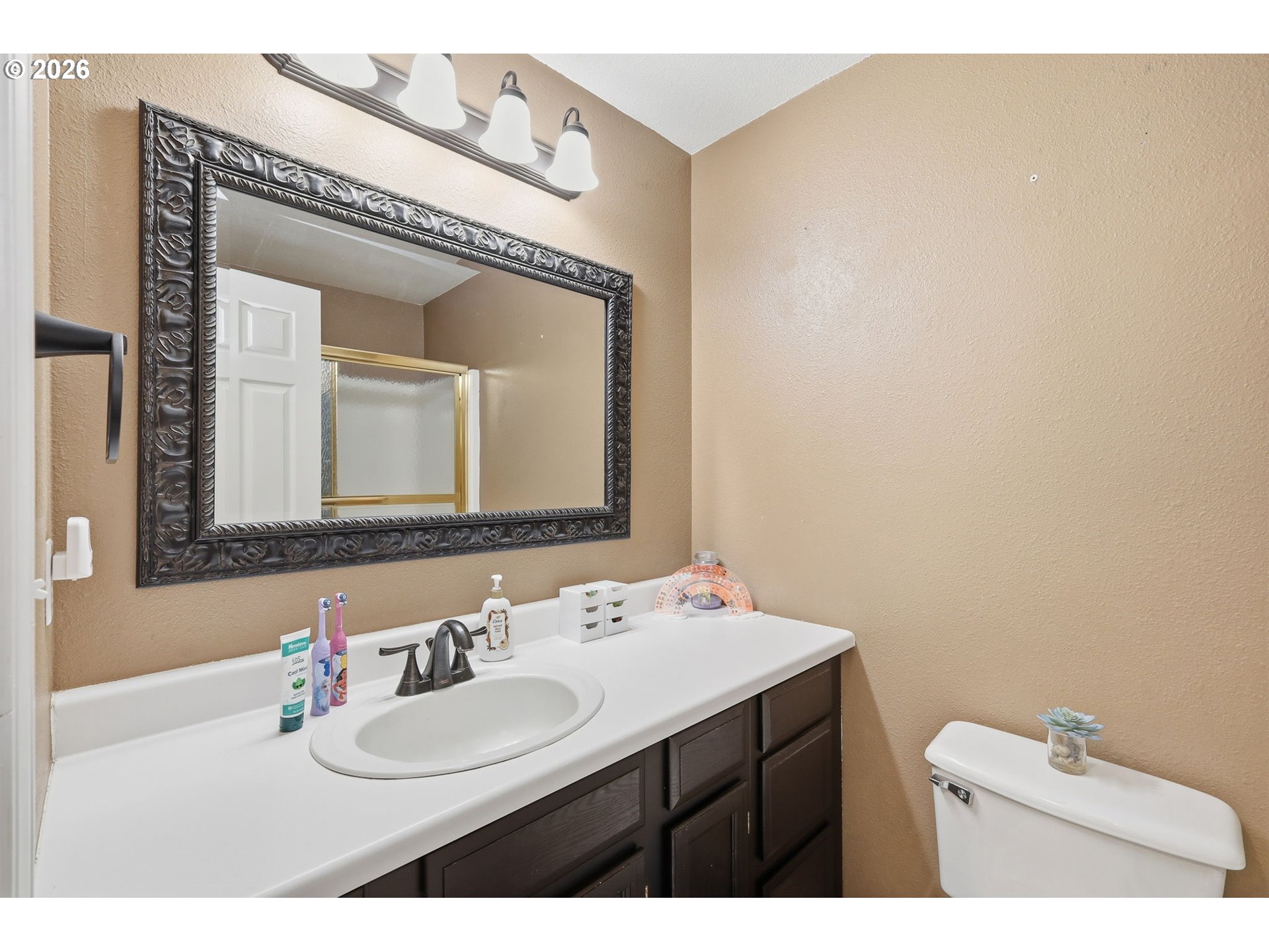 2075 Bryant Avenue Cottage Grove, OR 97424 - Photo 14 of 29 a bathroom with a sink mirror and a toilet
